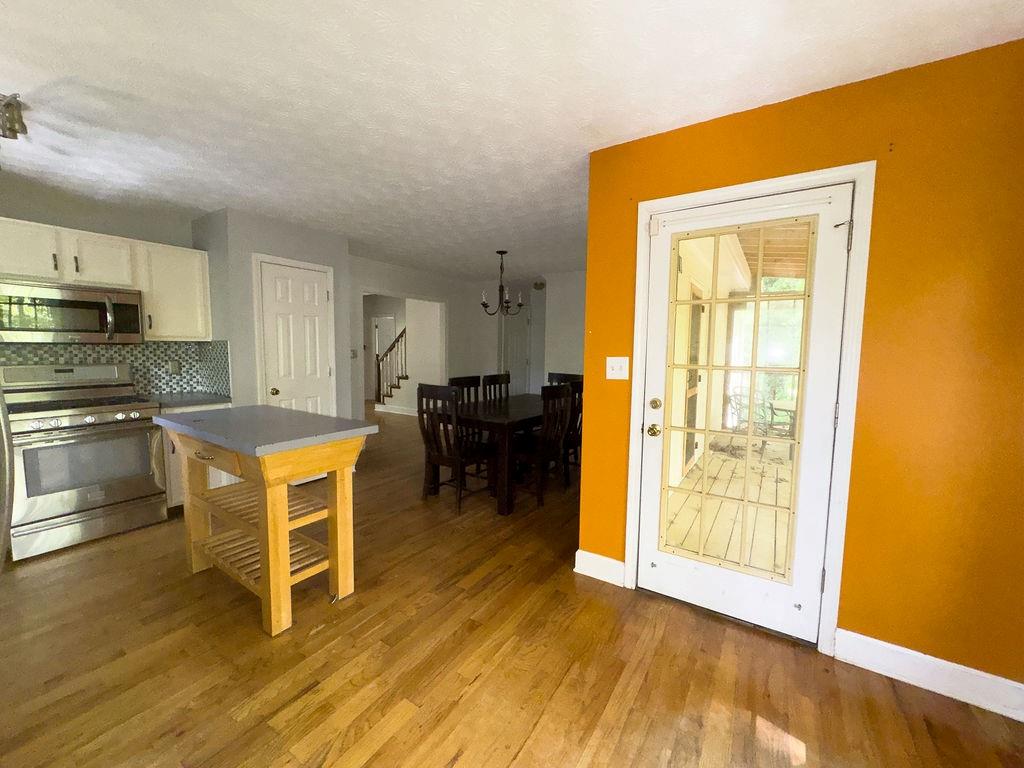 66 Stevenson Point Dallas, GA 30132 - Photo 17 of 39 a kitchen with wooden floors and appliances