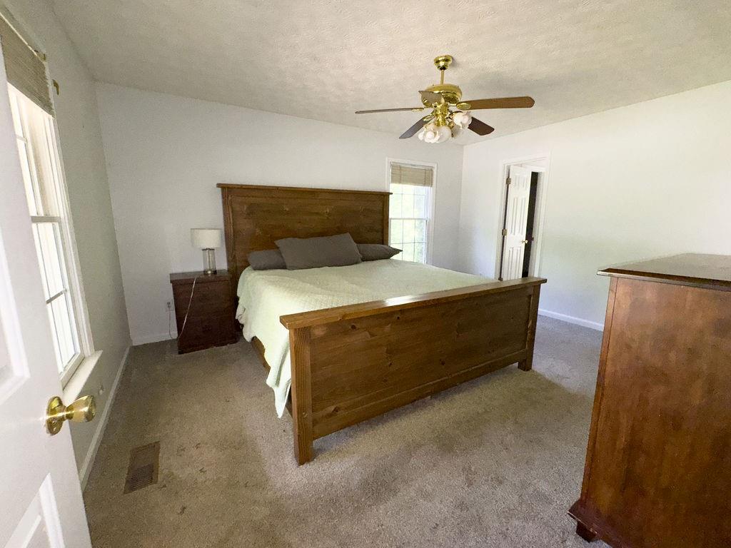 66 Stevenson Point Dallas, GA 30132 - Photo 19 of 39 a bedroom with a bed and a window