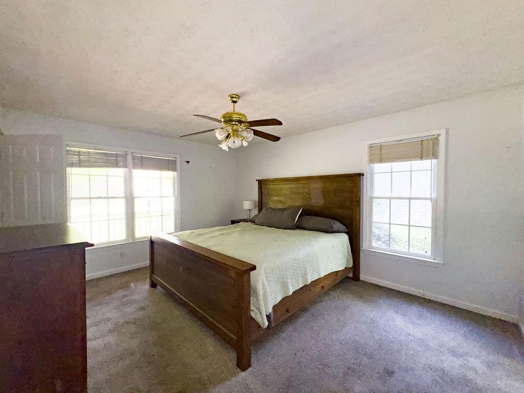 66 Stevenson Point Dallas, GA 30132 - Photo 20 of 39 a bedroom with a bed and window