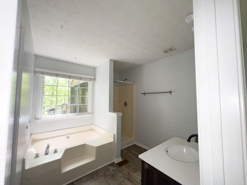 66 Stevenson Point Dallas, GA 30132 - Photo 22 of 39 a bathroom with a bathtub and a sink