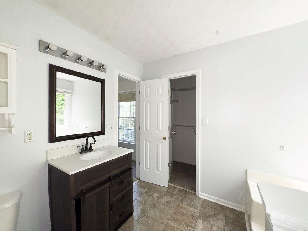 66 Stevenson Point Dallas, GA 30132 - Photo 23 of 39 a bathroom with a sink a mirror and a toilet