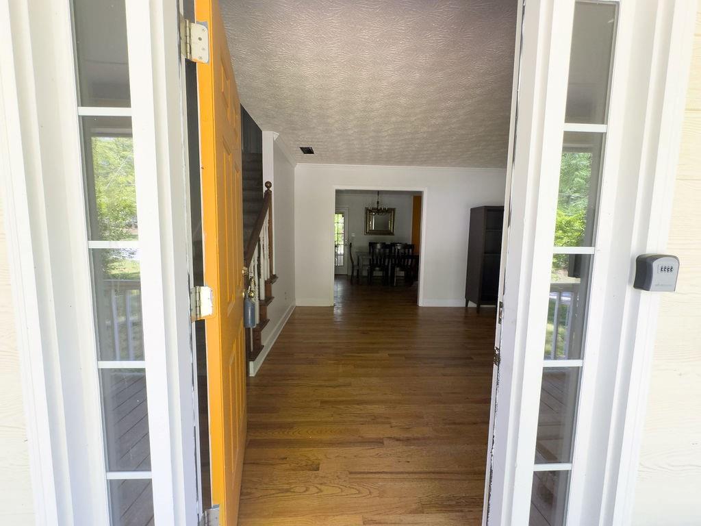 66 Stevenson Point Dallas, GA 30132 - Photo 7 of 39 a view of a hallway with wooden floor and windows
