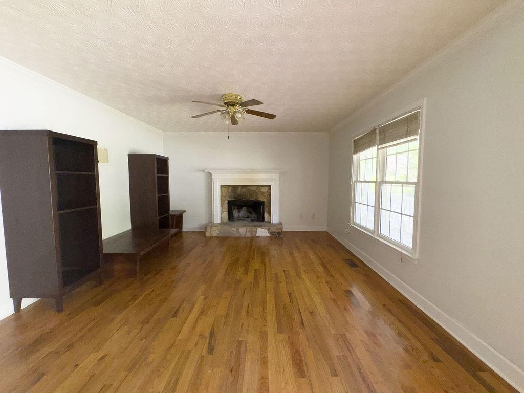 66 Stevenson Point Dallas, GA 30132 - Photo 10 of 39 a view of an empty room with a fireplace and a window