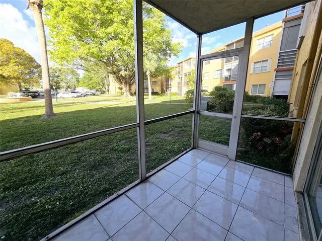 a view of a porch and garden