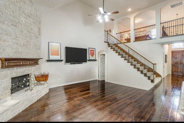 a view of a livingroom with a projector and furniture
