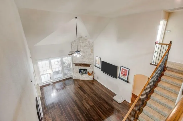 a room with pool table and windows