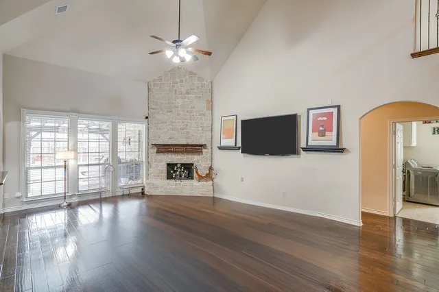 a room with pool table and windows