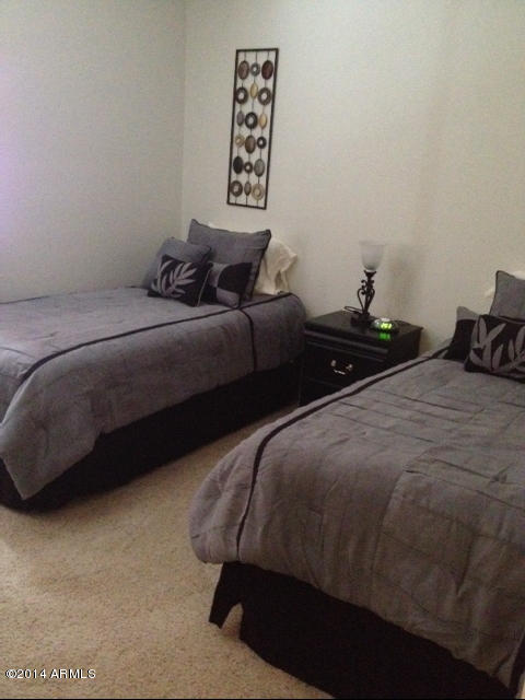 1250 South Rialto, Unit 62 Mesa, AZ 85209 - Photo 18 of 24 a bedroom with bed and a night stand
