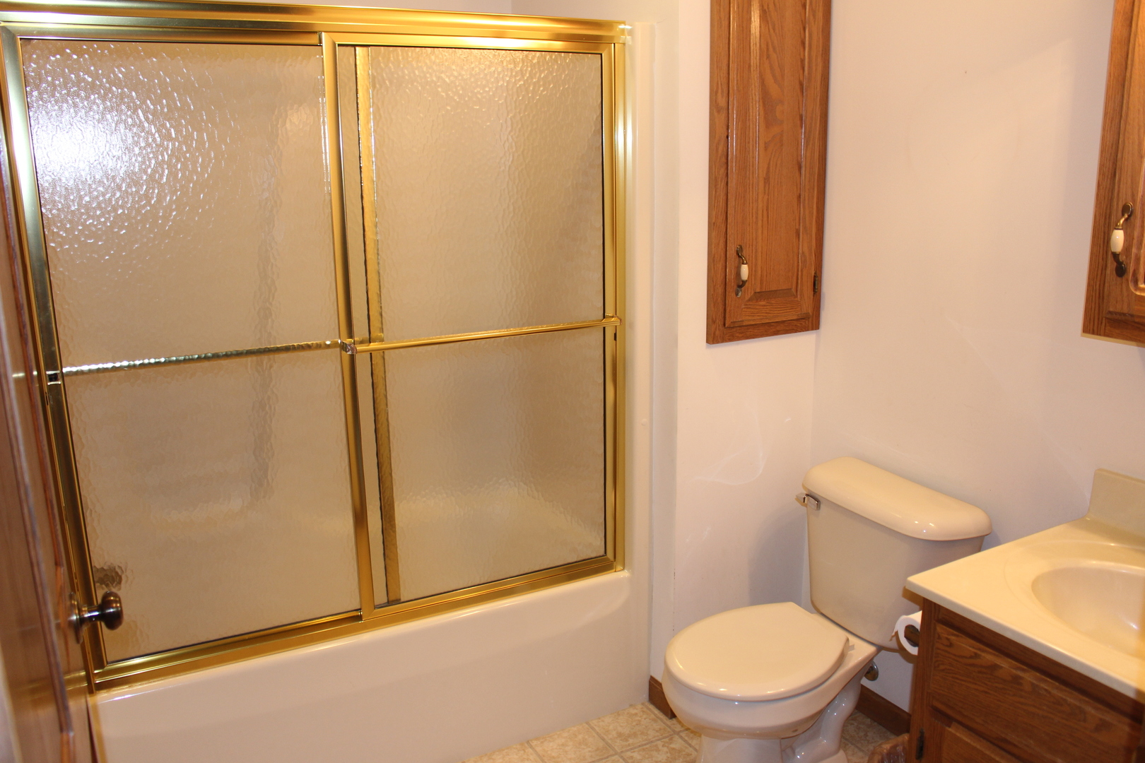 3 Delmar Drive Clinton, IL 61727 - Photo 30 of 44 a white toilet sitting next to a shower