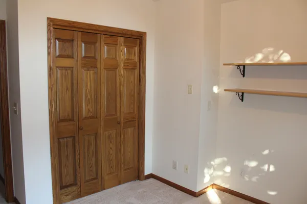 a view of a hallway with closet area