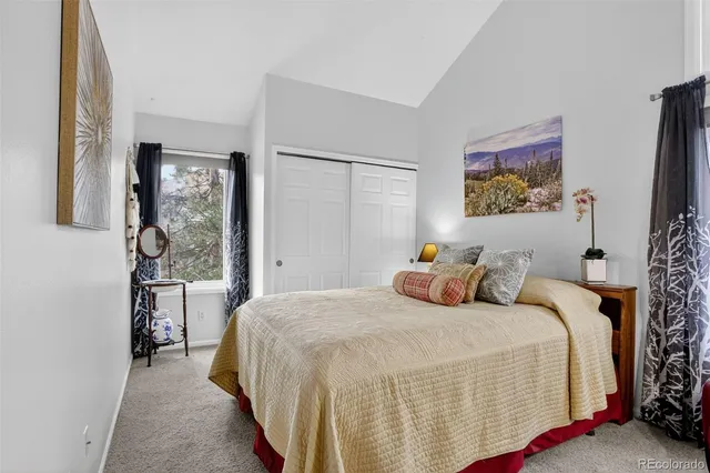 a bedroom with bed and a window