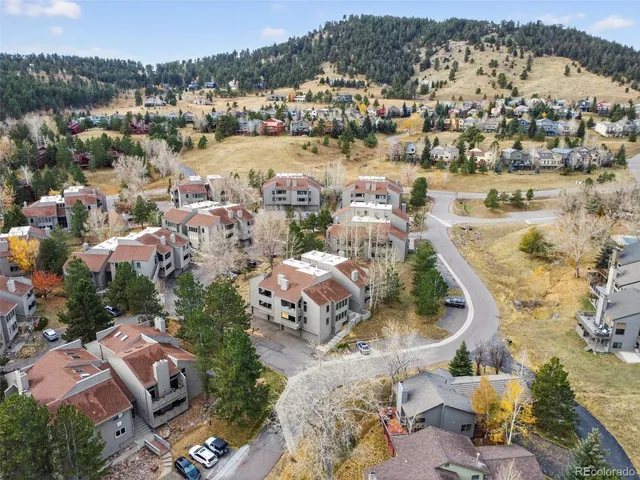 an aerial view of residential houses with outdoor space