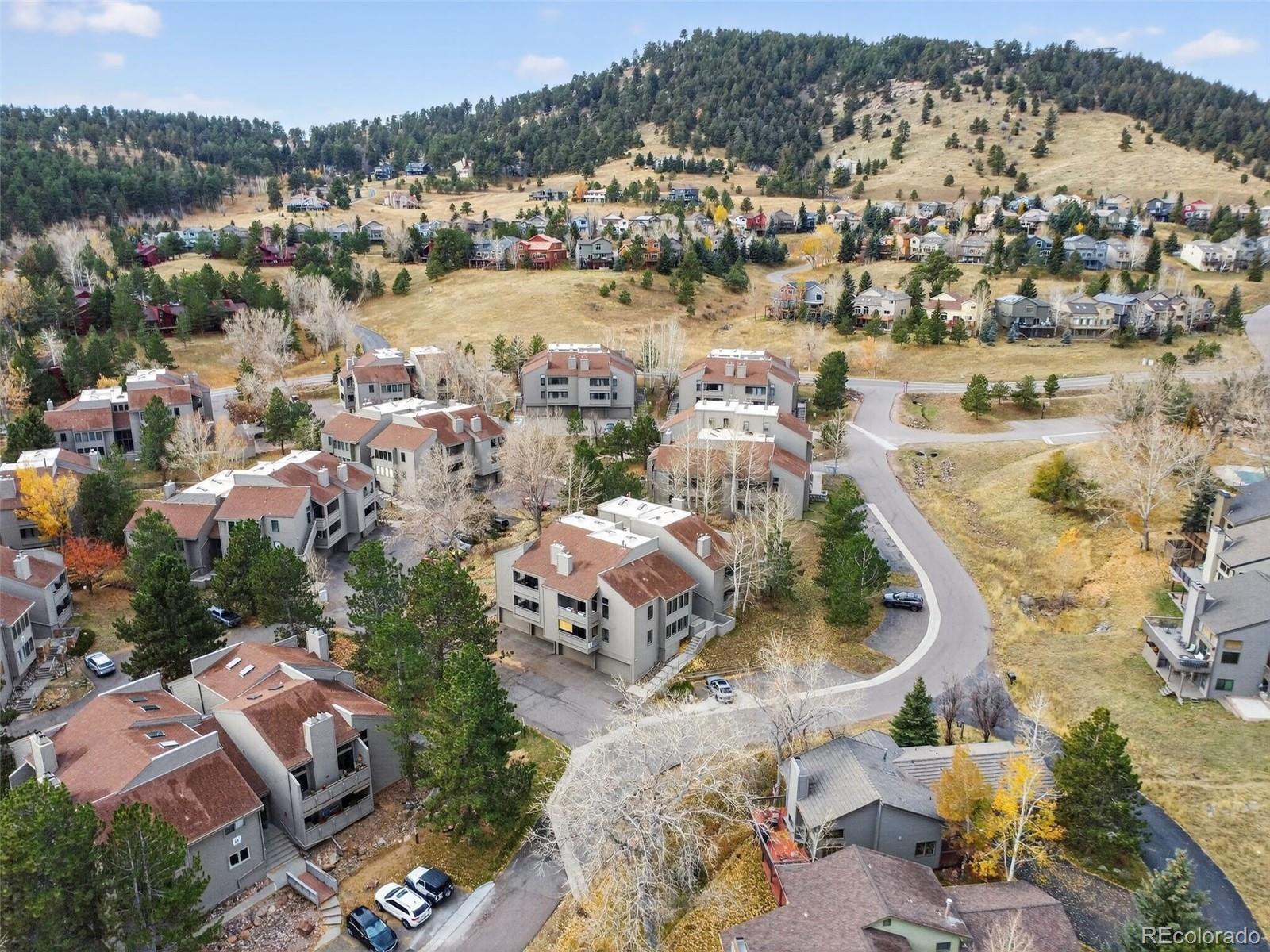 23660 Pondview Place, Unit E Golden, CO 80401 - Photo 3 of 26 an aerial view of residential houses with outdoor space