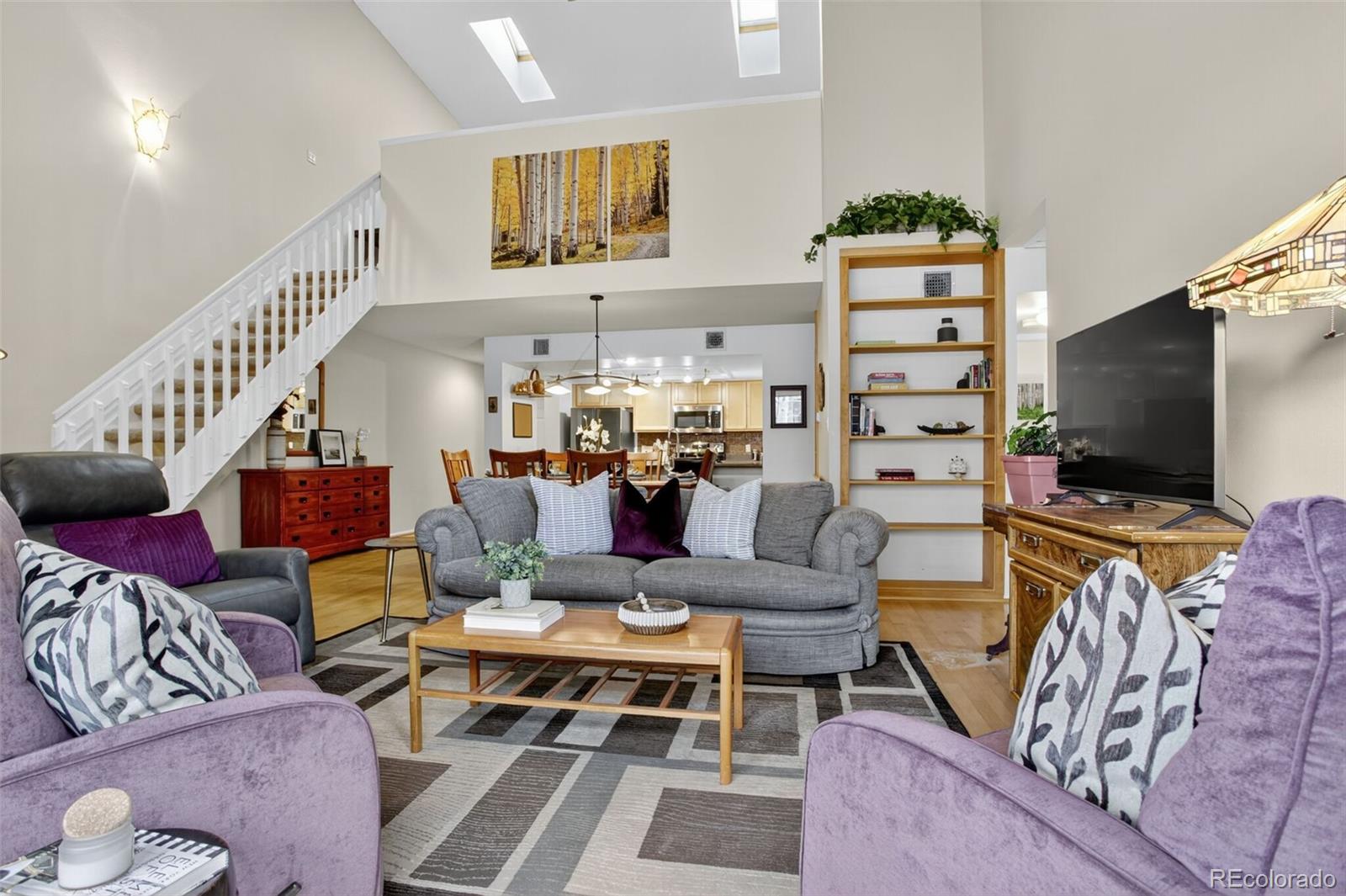 23660 Pondview Place, Unit E Golden, CO 80401 - Photo 9 of 26 a living room with furniture and a flat screen tv