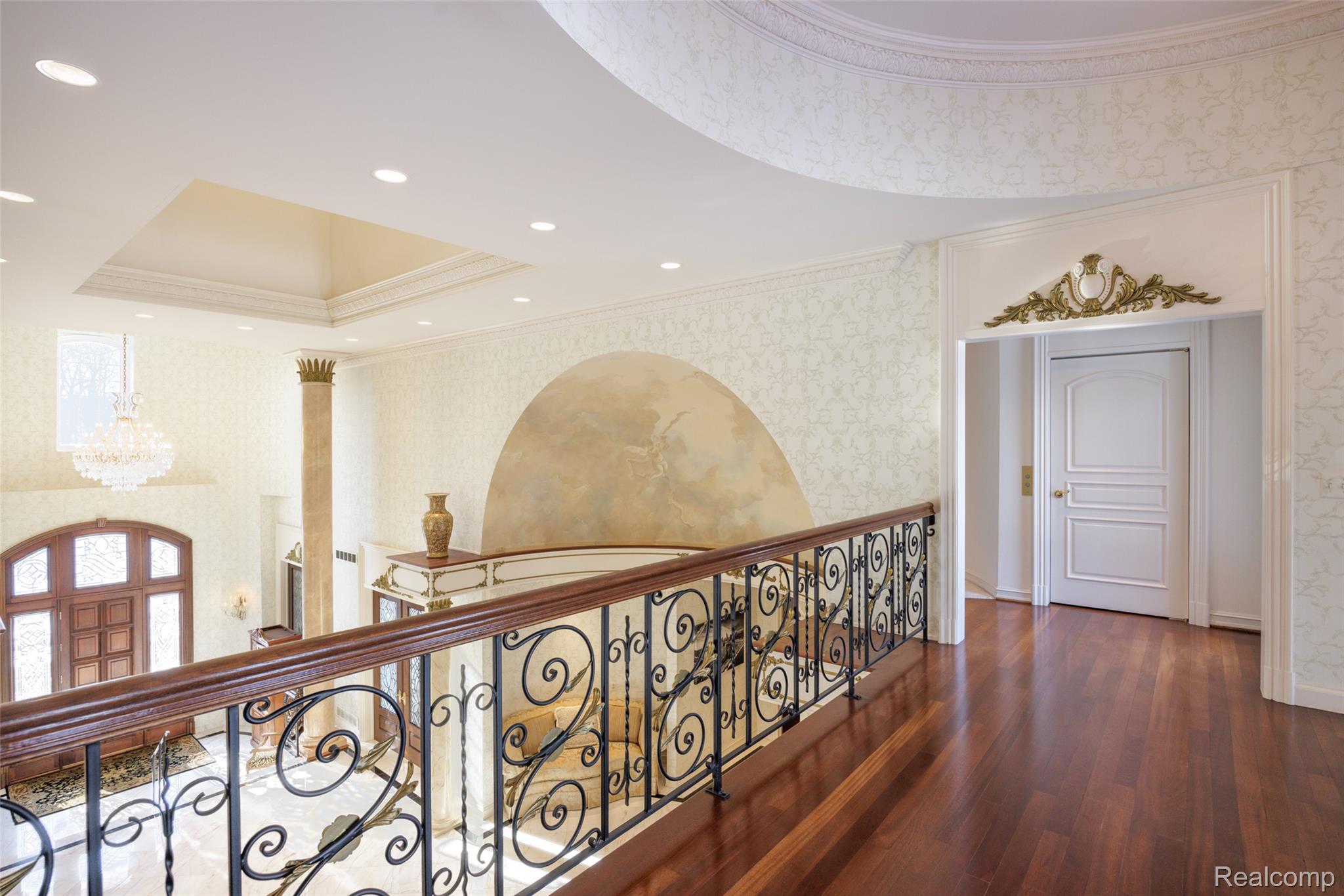 5165 Abbey Drive Rochester, MI 48306 - Photo 32 of 66 Upper-level hallway with wood-finish flooring, decorative wall coverings, recessed lighting, and an ornate archway trim