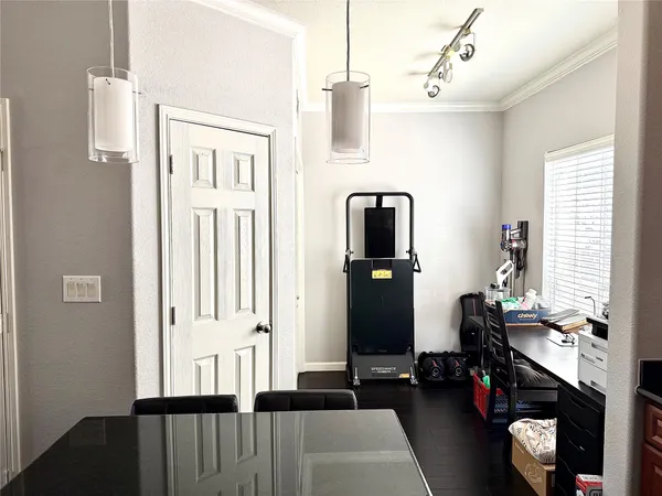 a bedroom with a bed and flat tv screen