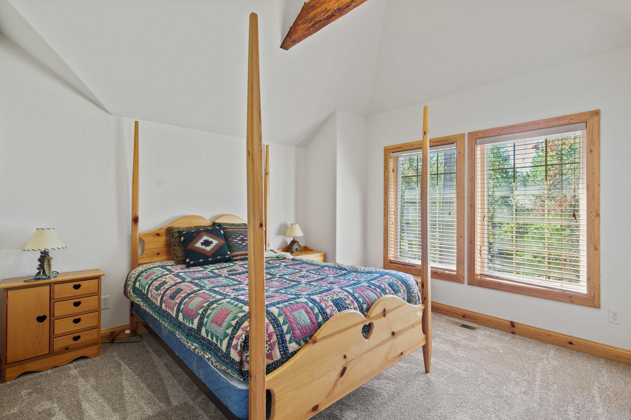 58026 Kinglet Road Sunriver, OR 97707 - Photo 27 of 39 a bedroom with a bed and a window