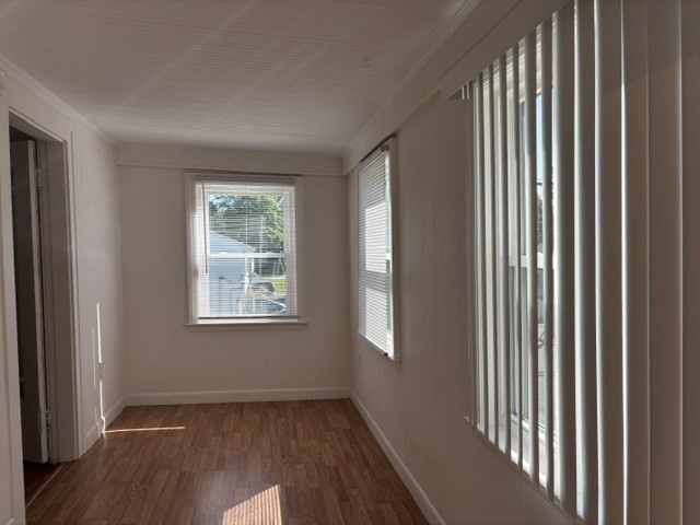 45 Webster Street, Unit 2 Woburn, MA 01801 - Photo 10 of 10 an empty room with wooden floor and windows