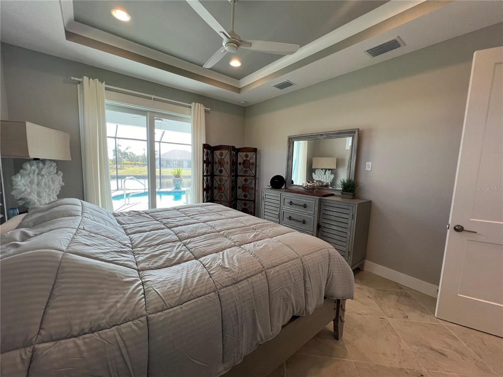 15419 Appleton Boulevard Port Charlotte, FL 33981 - Photo 14 of 43 a bedroom with a bed and a closet