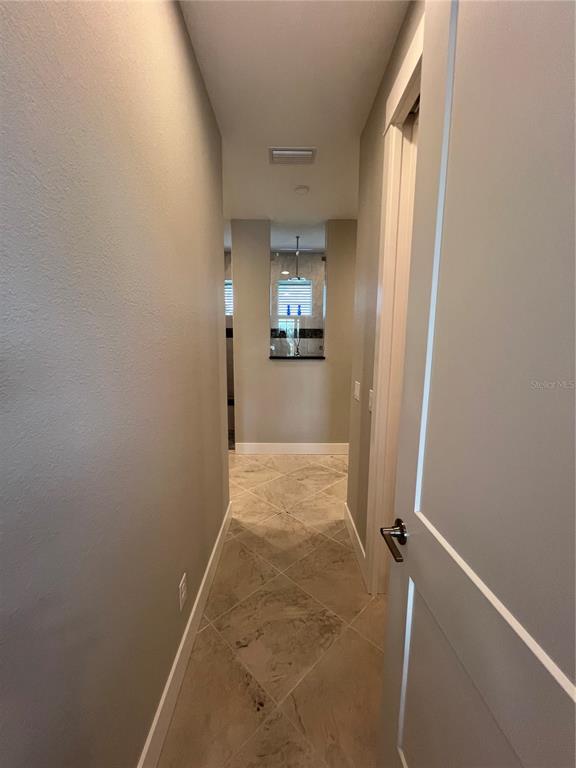 15419 Appleton Boulevard Port Charlotte, FL 33981 - Photo 17 of 43 an empty room with a door