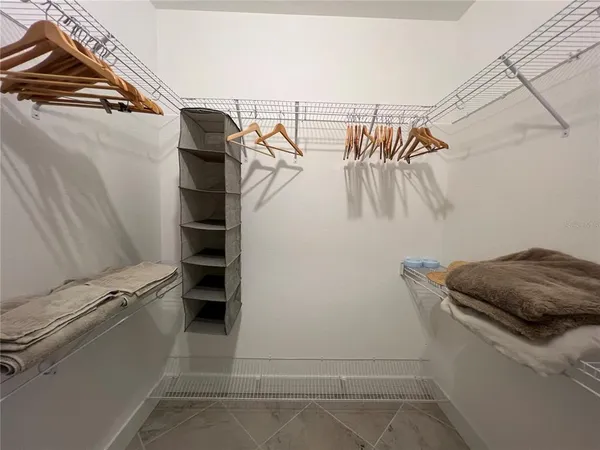a bathroom with double vanity and a mirror