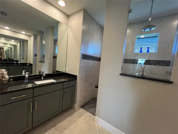 a bathroom with a sink and a mirror