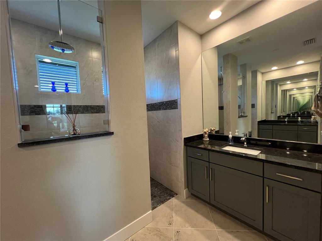 15419 Appleton Boulevard Port Charlotte, FL 33981 - Photo 20 of 43 a bathroom with a sink and a mirror