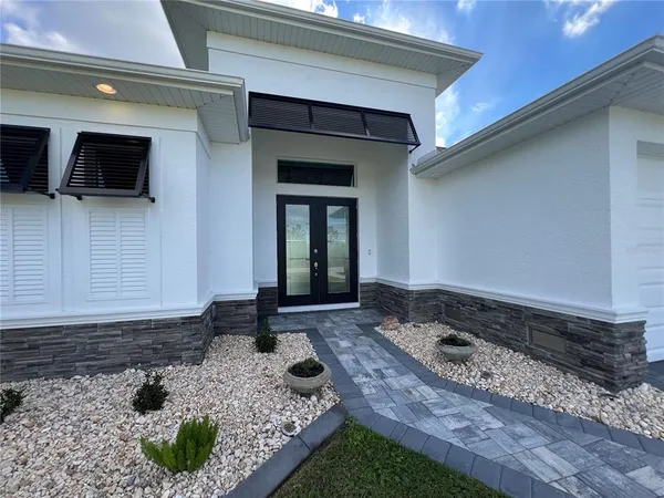 a house view with a backyard space