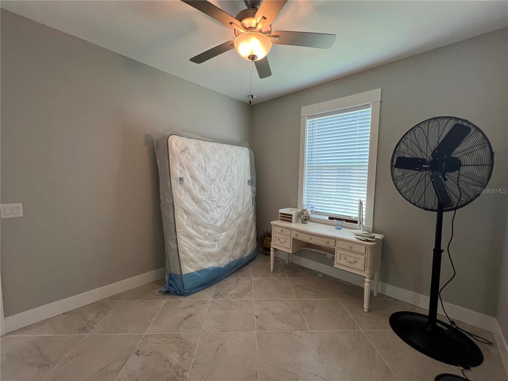15419 Appleton Boulevard Port Charlotte, FL 33981 - Photo 29 of 43 a living room with furniture and a chandelier