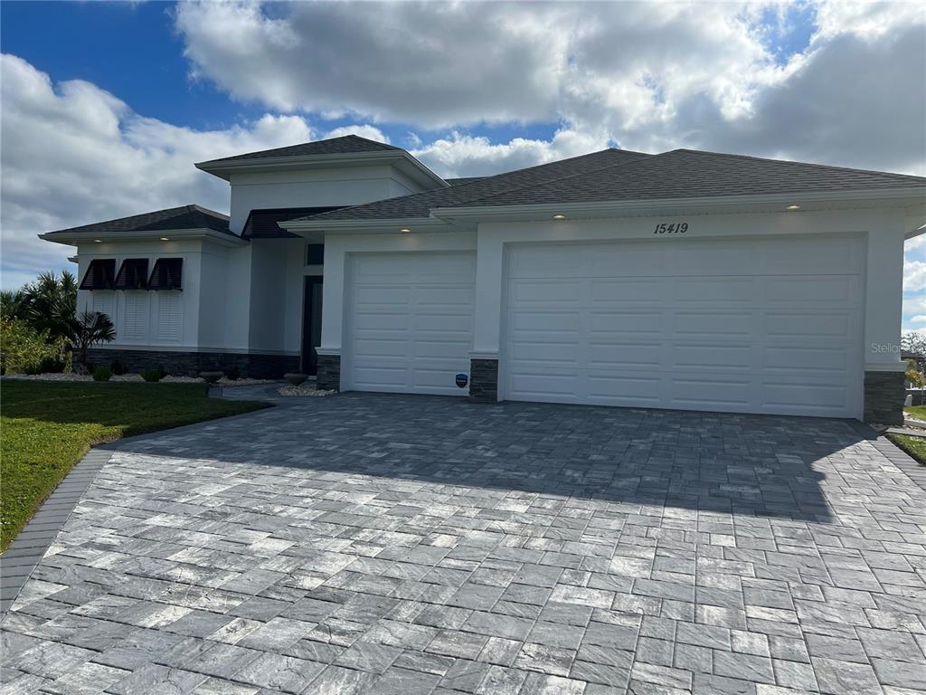 15419 Appleton Boulevard Port Charlotte, FL 33981 - Photo 3 of 43 a front view of a house