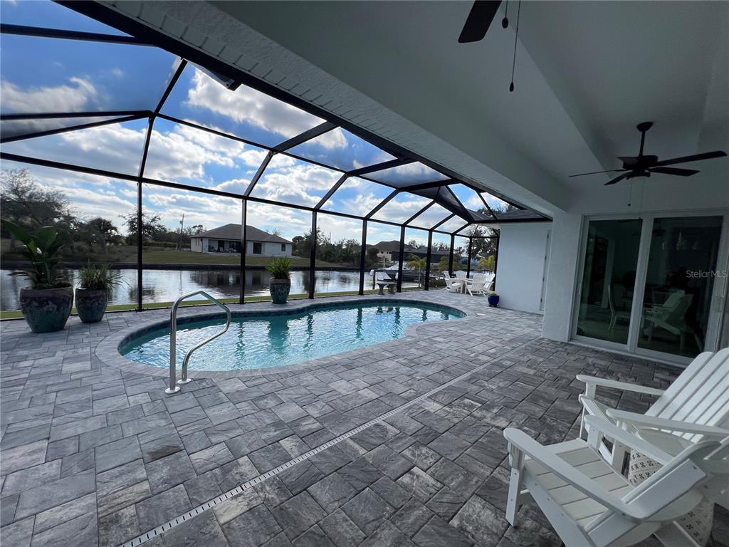 15419 Appleton Boulevard Port Charlotte, FL 33981 - Photo 31 of 43 a view of a swimming pool with a patio