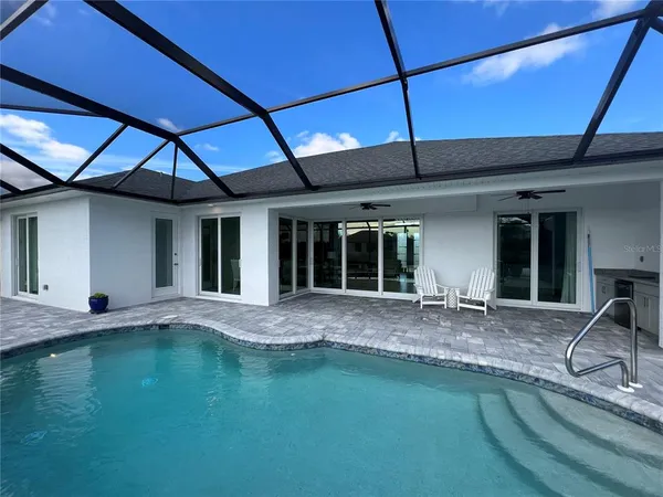 a view of swimming pool with a patio
