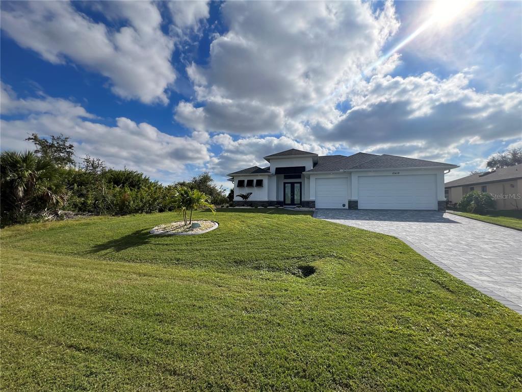 15419 Appleton Boulevard Port Charlotte, FL 33981 - Photo 43 of 43 a view of a house with a big yard