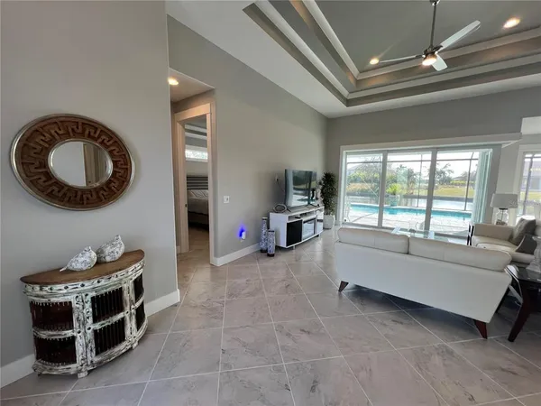 a living room with furniture and a large window