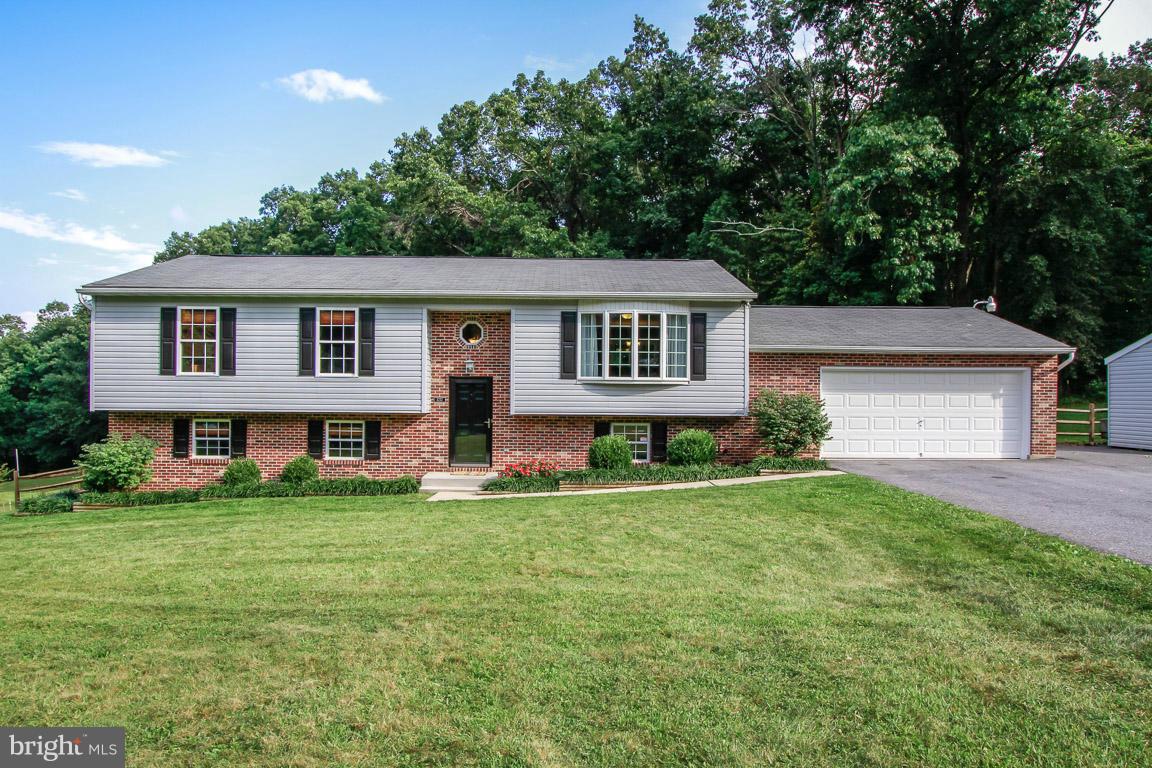 3237 Lineboro Road Manchester, MD 21102 - Photo 1 of 26 front view of a house with a yard