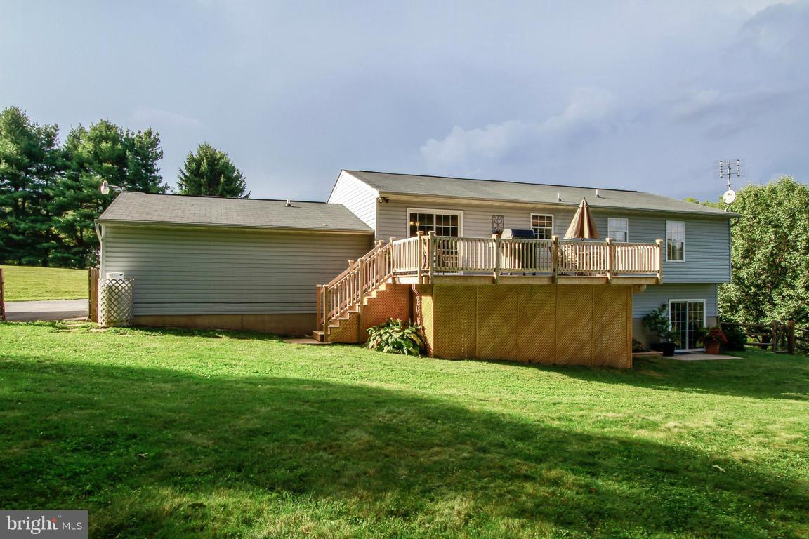 3237 Lineboro Road Manchester, MD 21102 - Photo 2 of 26 a front view of a house with a yard and garage