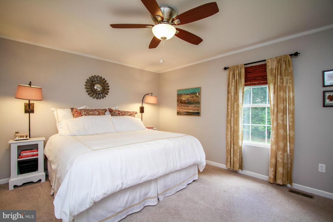 3237 Lineboro Road Manchester, MD 21102 - Photo 15 of 26 a bedroom with a large bed and a window
