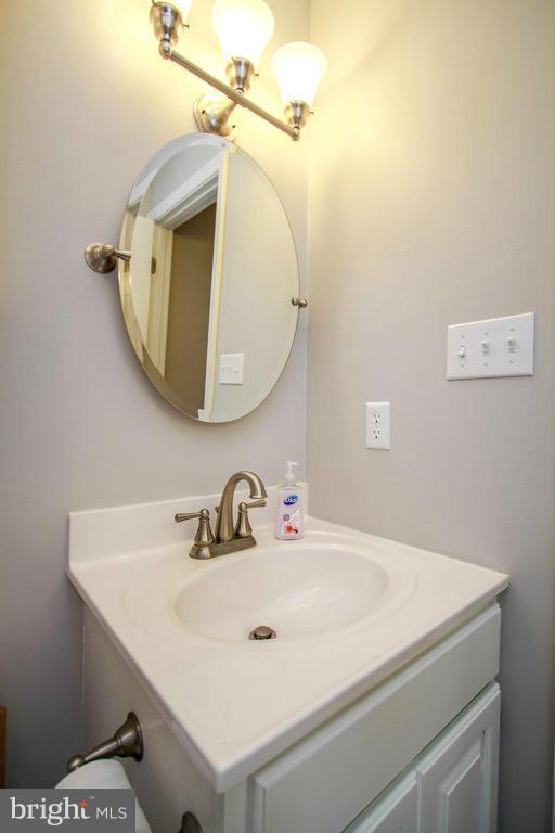 3237 Lineboro Road Manchester, MD 21102 - Photo 18 of 26 a bathroom with a sink and a mirror