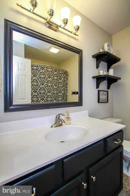 3237 Lineboro Road Manchester, MD 21102 - Photo 22 of 26 a bathroom with a sink and a mirror