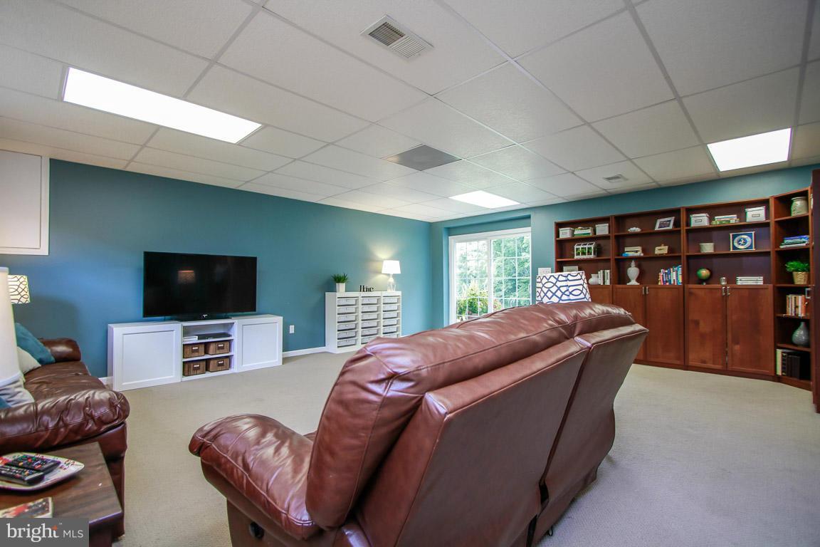 3237 Lineboro Road Manchester, MD 21102 - Photo 25 of 26 a living room with furniture and a flat screen tv