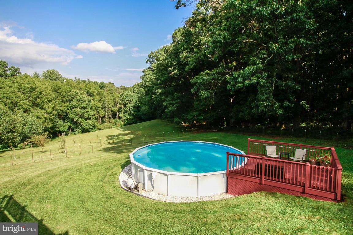 3237 Lineboro Road Manchester, MD 21102 - Photo 6 of 26 a view of a swimming pool with a yard