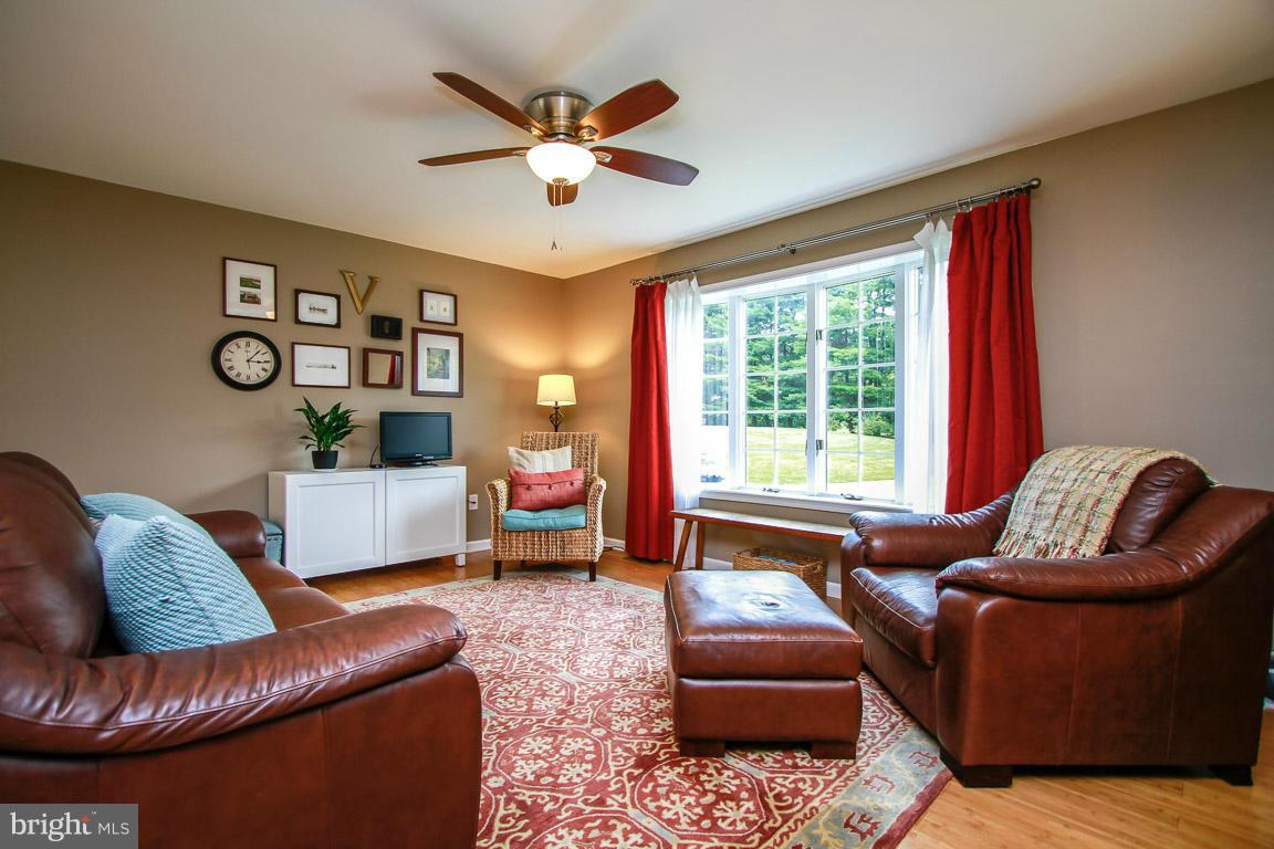 3237 Lineboro Road Manchester, MD 21102 - Photo 9 of 26 a living room with furniture ceiling fan and a window