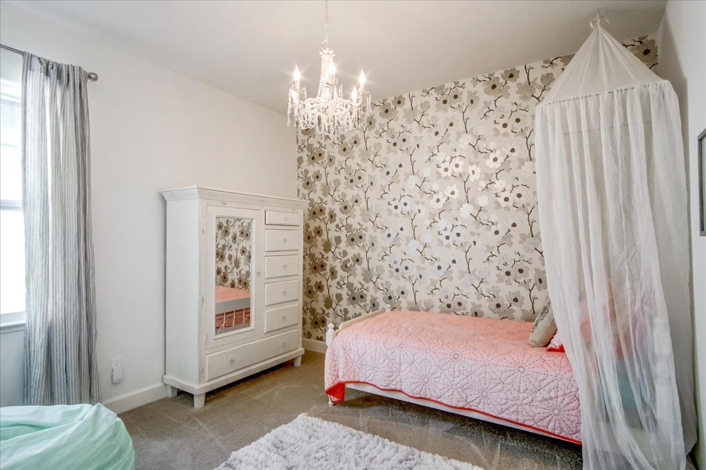 1130 Ruby Way Gilroy, CA 95020 - Photo 15 of 36 a bedroom with a bed and a window