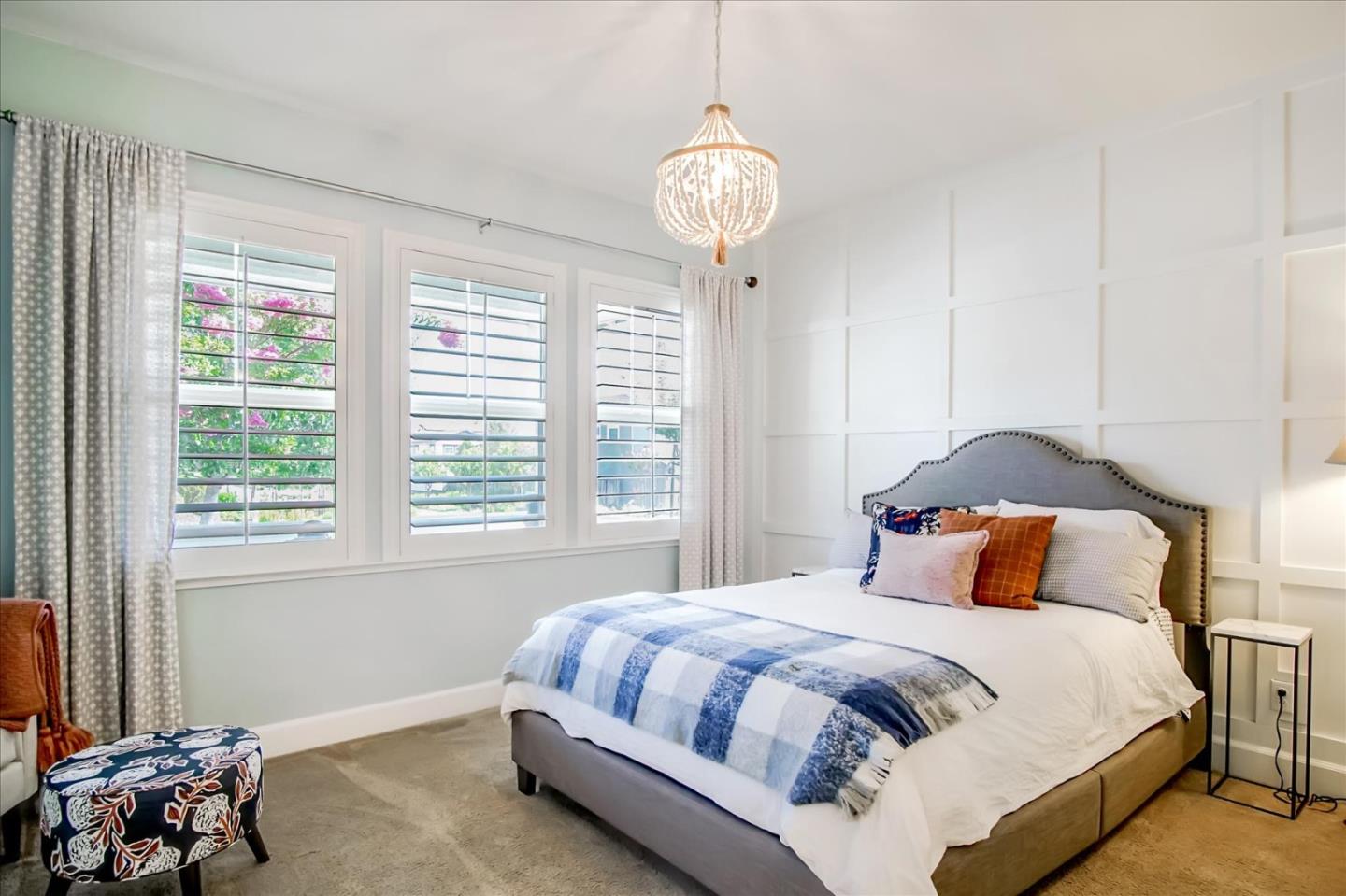 1130 Ruby Way Gilroy, CA 95020 - Photo 16 of 36 a bedroom with a bed and a chandelier