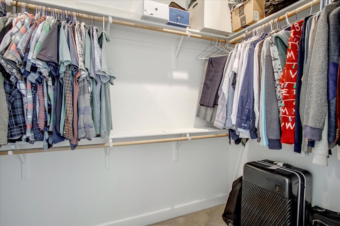 1130 Ruby Way Gilroy, CA 95020 - Photo 20 of 36 a view of walk in closet with clothes and shoes