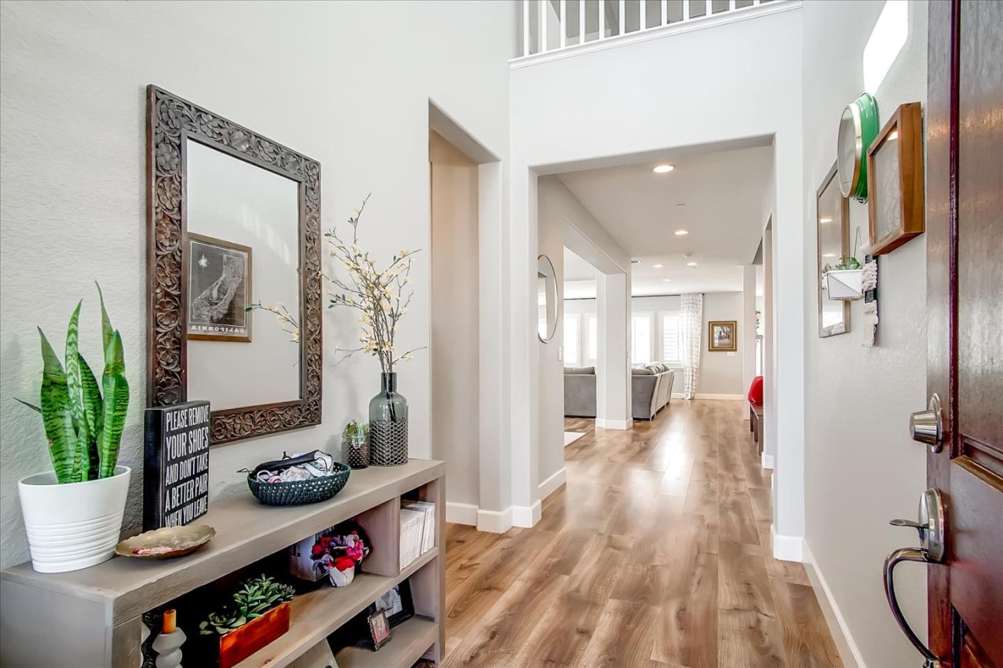 1130 Ruby Way Gilroy, CA 95020 - Photo 3 of 36 a hallway with wooden floor and breakfast area