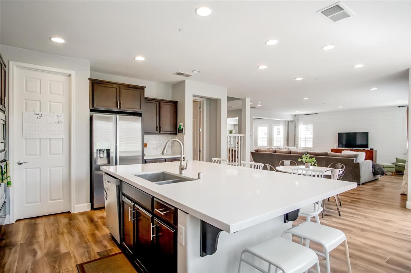 1130 Ruby Way Gilroy, CA 95020 - Photo 7 of 36 a kitchen with stainless steel appliances a sink and a refrigerator