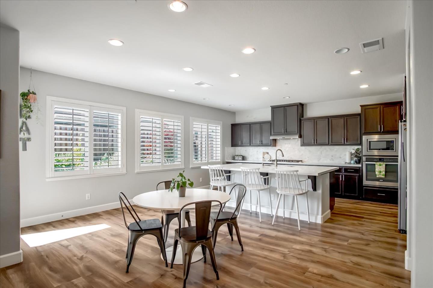 1130 Ruby Way Gilroy, CA 95020 - Photo 10 of 36 a view of a dining room with furniture window and wooden floor