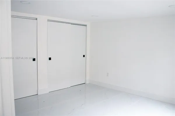 a view of a room with a fan and a fan