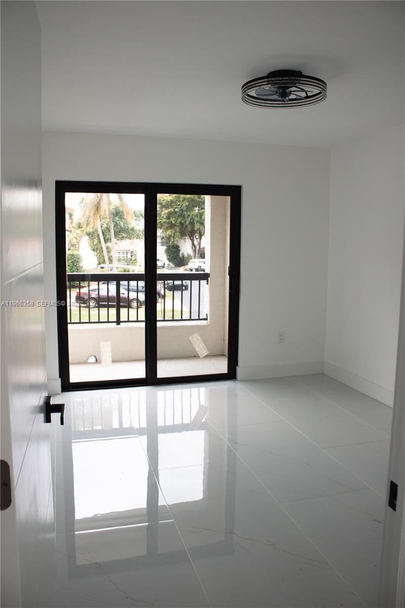 10433 Southwest 118th Court Miami, FL 33186 - Photo 16 of 32 a view of an empty room with a window